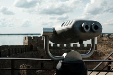 Coin-operated binocular viewer set up on a tower of Ram Fortress, facing the Danube River. A popular tourist destination in Serbia country