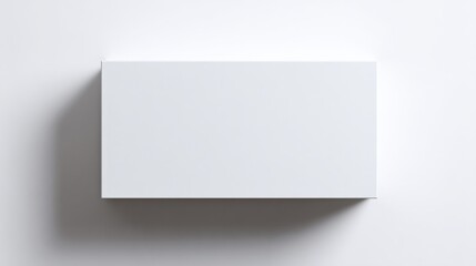 Fototapeta premium Empty White Rectangular Cardboard Box with Smooth Surface and Edges Placed on Light Gray Background for Storage or Packaging Concept