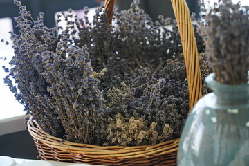 Dried lavender bouquet in a woven basket. Rustic floral arrangement for home decor, aromatherapy,...