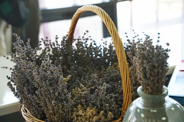 Dried lavender bouquet in a woven basket. Rustic floral arrangement for home decor, aromatherapy,...