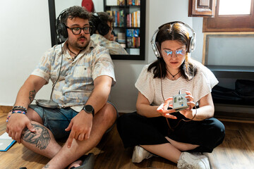 Millennials rediscovering retro technology: enjoying discman and minidisc player