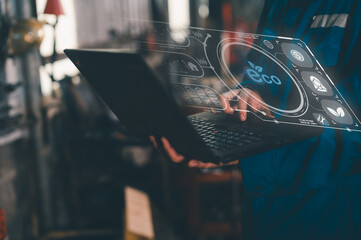 A person interacts with a laptop displaying futuristic eco-friendly digital interface elements,...