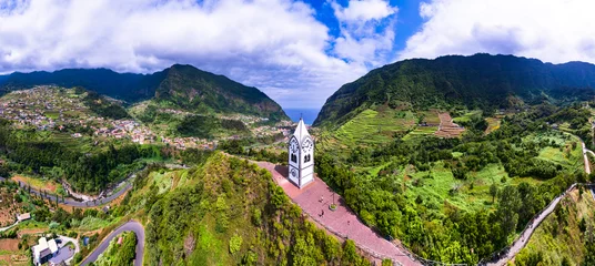 Fotobehang Nossa Senhora de Fatima Chapel - iconic small church of Madeira island surrounded by stunning green mountains in Sao Vicente village. aerial view. Portugal © Freesurf