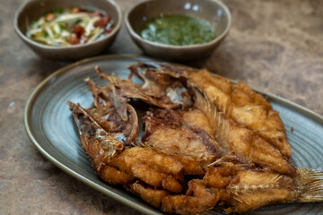 Deep-fried Sea bass with Fish Sauce served on plate