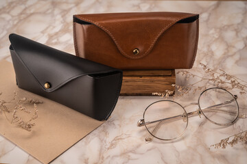 concept marketing photo of leather glasses cases