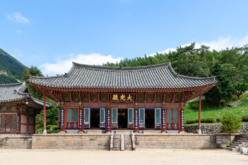 Naklejka premium Korean traditional temple with Buddhist wooden buildings, traditional patterns of dancheong and roof tiles