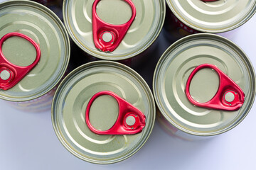 Close-up view of the top of a canned food lid,Tin silver cans for tinned food on wooden...