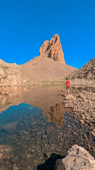 Breathtaking view of the Ibón de Lavasar and the rock formations of the Agujas de Lavasar, capturing the natural splendor of the Chistau Valley in the Aragon Pyrenees.