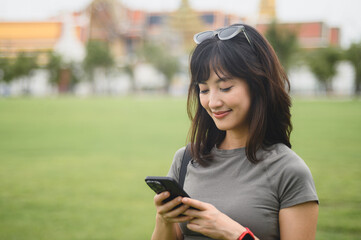 Happy solo southeast asian woman teenager blogger explorer on world travel. tourism concept to...