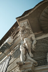 Detailed view of a supporting male statue on a historical building in Vrsac town, Serbia.