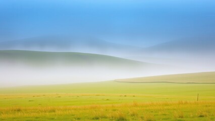 Fototapeta premium Foggy Green Hills with Lush Grass Fields 