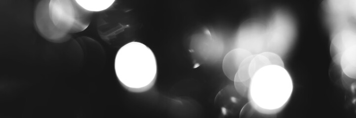 Blurred lights black and white bokeh abstract background banner