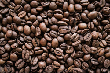 Roasted coffee beans close-up macro shot.Rough textured background pattern.