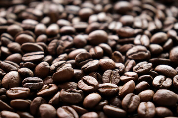 Roasted coffee beans close-up macro shot.Rough textured background pattern.