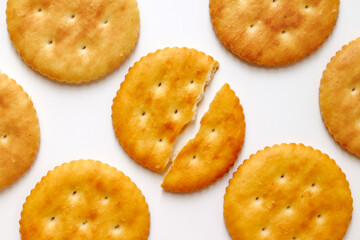 A full cracker. One piece of cracker in the middle is broken.