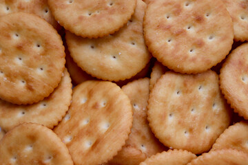 Macro shot of randomly placed crackers. Textured background.