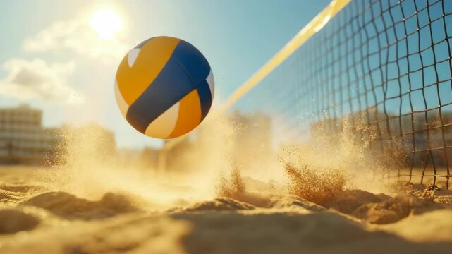 Dynamic volleyball impact on sandy beach at sunrise captured in motion