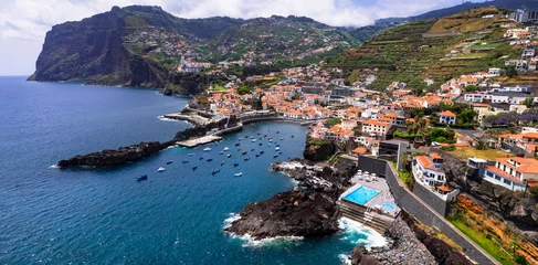 Fotobehang Madeira island travel and landmarks. Portugal. Charming traditional fishing village Camara de Lobos. Popular tourist destination. aerial drone panoramic view of bay © Freesurf