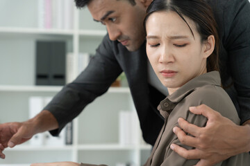 Manager or senior sexually harassed a female colleague by touch her shoulder. Sexual harassment in office. feel anxious and stressed from being harassed. molest, assault, inappropriate, discrimination