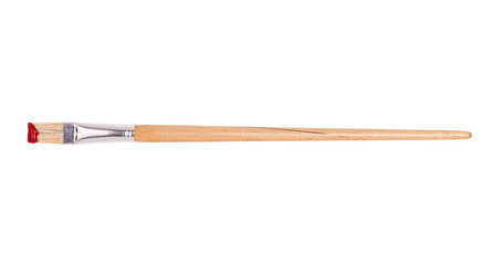 Flat wooden paintbrush with red paint on bristles, isolated on white backgroun, clipping path