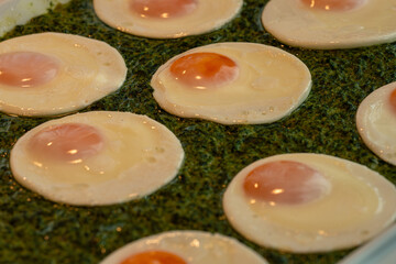 Photo of a sunny-side-up fried egg served on a bed of fresh green spinach. A healthy and vibrant dish perfect for breakfast menus, vegetarian meals, or clean eating concepts