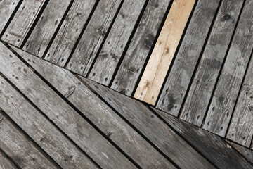 Close-up of weathered wooden planks arranged in a neat geometric pattern