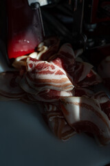 Photo of sliced meat illuminated by warm sunlight. The natural lighting enhances the juicy texture...