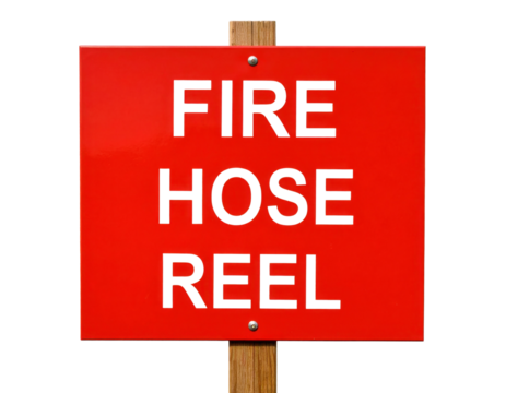 A red rectangular sign with bold black text reading "FIRE HOSE REEL" mounted on a wooden post.