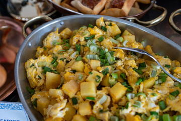 Photo of fried eggs served with diced potatoes in a restaurant setting. The hearty and rustic meal is beautifully presented, highlighting golden potatoes and perfectly cooked eggs—ideal for breakfast,