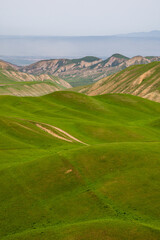 Serene dirt road through tranquil mountainous landscape