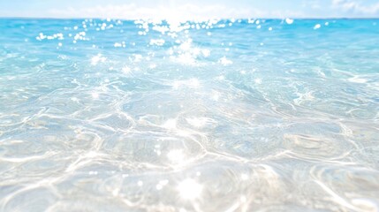 Obraz premium A serene view of crystal-clear ocean water shimmering under the sunlight, inviting relaxation and tranquility.