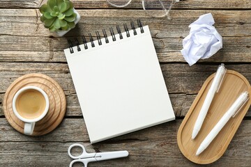 Flat lay composition with open blank notebook on wooden table