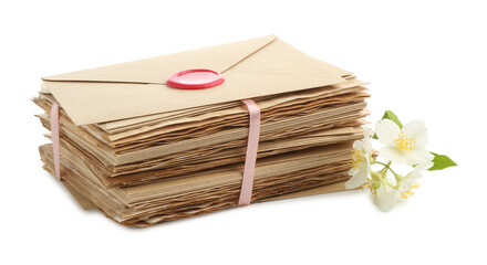 Stack of love letters and flowers isolated on white