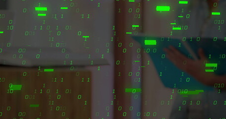 Cascading green binary digits overlaying blurred office shelving, with person holding blue folder