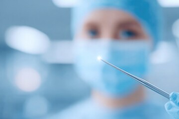 blurred background surrounds surgeon holding scalpel while focused on operation offering ample copy space