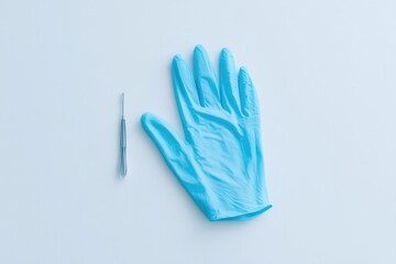 pair of artistically placed minimalist surgical gloves on plain white background