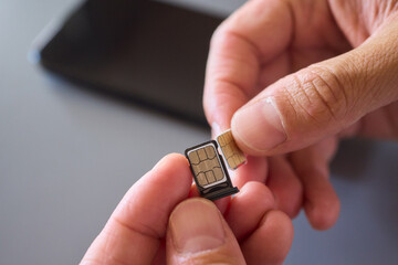 Detailed Process of Installing a SIM Card Utilizing Various Smartphone Components and Accessories