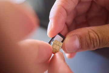 Detailed Process of Installing a SIM Card Utilizing Various Smartphone Components and Accessories