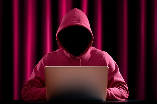 Mysterious hooded figure using laptop, anonymous cybercrime concept on black