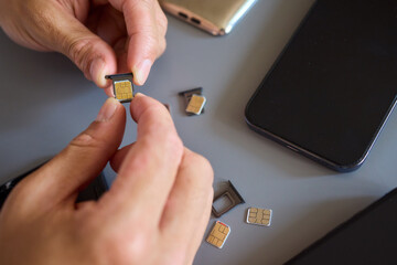 Detailed Process of Installing a SIM Card Utilizing Various Smartphone Components and Accessories