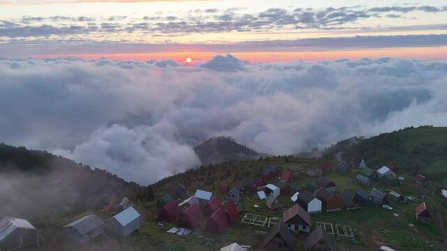 Above the Clouds at Gomismta &ndash; Drone View of Sunset Light and Remote Mountain Homes
