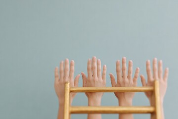 close-up of diverse hands reaching for opportunities under minimalistic lighting