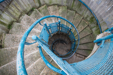 A concrete spiral staircase down, at Alexandra Road estate, a brutalist architecture in London, England