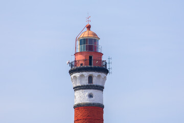 red lighthouse on a blue sky