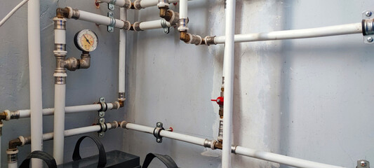 Efficient home plumbing concept: interior water pressure system with PVC piping, metal fittings,...