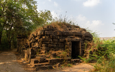 Weathered Ancient Stone Structure in Wilderness