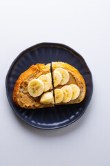 Toast with peanut paste and banana slices