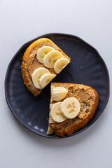 Toast with peanut paste and banana slices