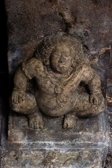Ancient Stone Carving of Crouching Figure