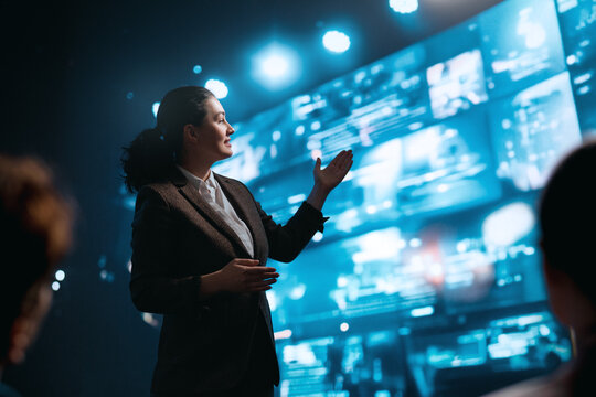 A woman is speaking on stage